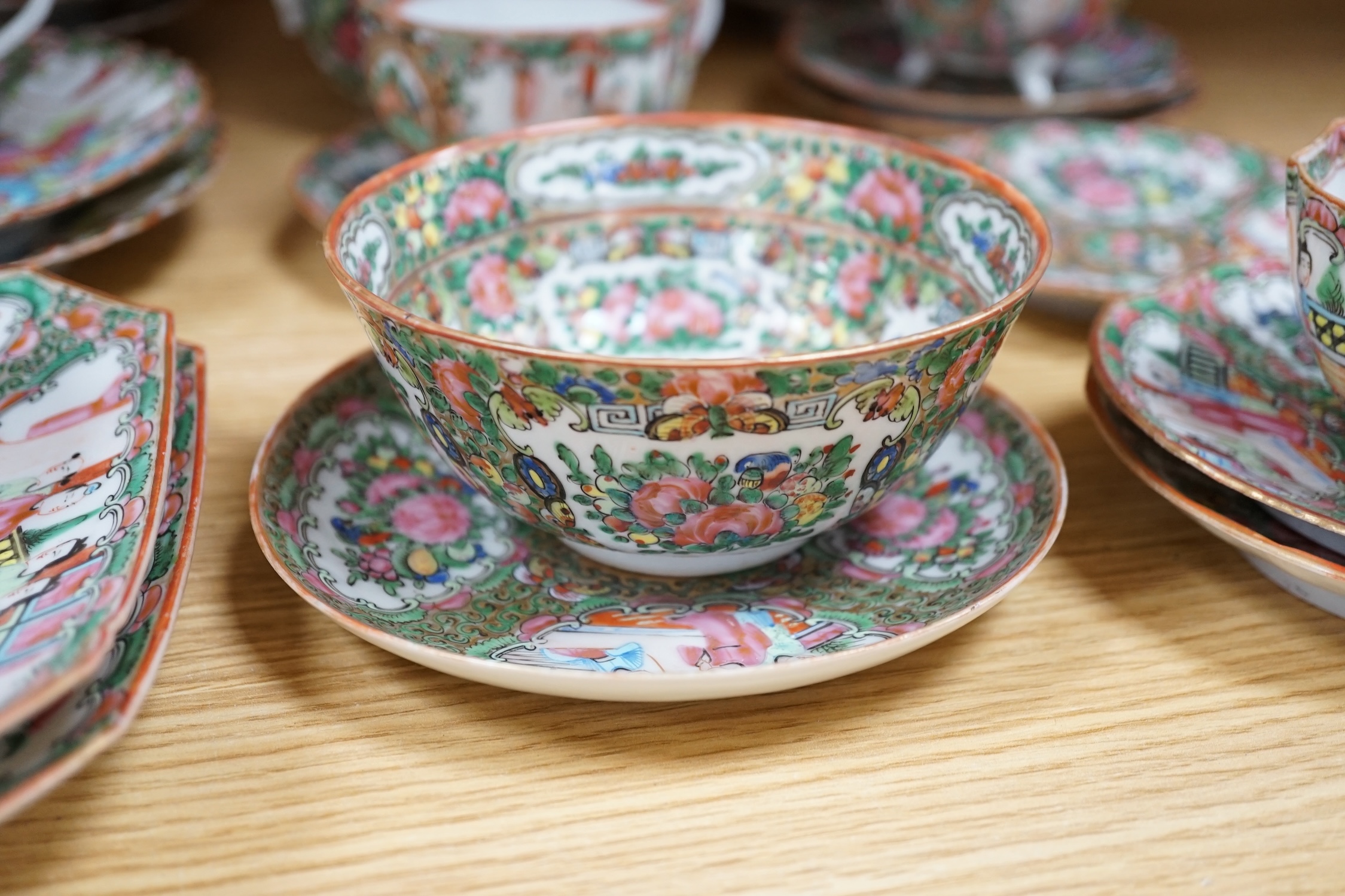 A Chinese famille rose part tea set including: five cups saucers and side plates, a teapot and cover, sugar bowl and cover, a cream jug, four cake plates and two square plates (27)